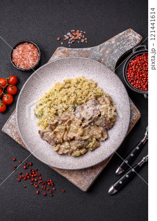 Bowl of food with beef, bulgur, tomatoes, zucchini and sauce Bowl of food with beef, bulgur, tomatoes, zucchini and sauce 121441614