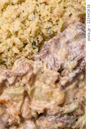 Bowl of food with beef, bulgur, tomatoes, zucchini and sauce Bowl of food with beef, bulgur, tomatoes, zucchini and sauce 121441616