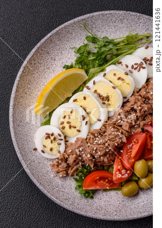 Salad with tuna pieces, boiled egg, cherry tomatoes, lettuce Salad with tuna pieces, boiled egg, cherry tomatoes, lettuce 121441636