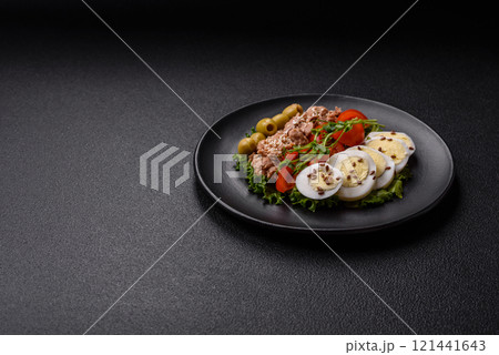 Salad with tuna pieces, boiled egg, cherry tomatoes, lettuce Salad with tuna pieces, boiled egg, cherry tomatoes, lettuce 121441643