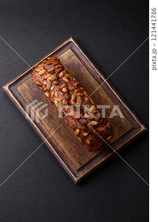 Brown bread with seeds, grains, salt and spices 121441786