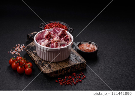Raw chicken hearts with salt, spices and herbs Raw chicken hearts with salt, spices and herbs 121441890