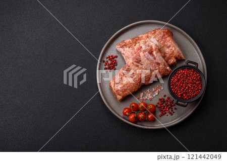 Pork ribs in sweet and sour sauce with salt and spices Pork ribs in sweet and sour sauce with salt and spices 121442049