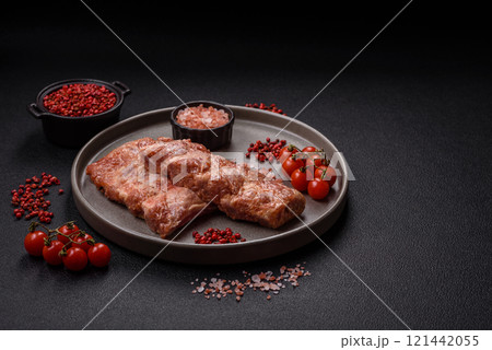 Pork ribs in sweet and sour sauce with salt and spices 121442055