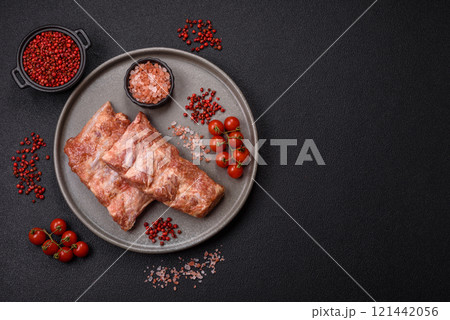 Pork ribs in sweet and sour sauce with salt and spices Pork ribs in sweet and sour sauce with salt and spices 121442056