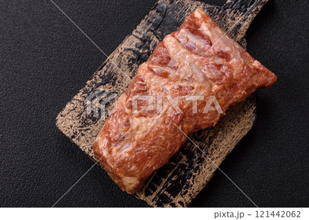 Pork ribs in sweet and sour sauce with salt and spices 121442062