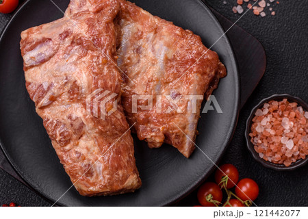 Pork ribs in sweet and sour sauce with salt and spices 121442077