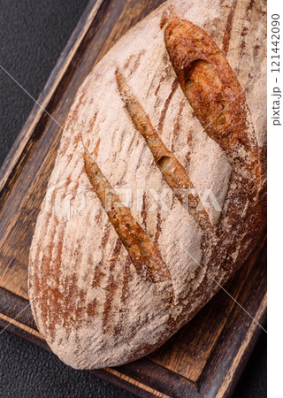 Brown bread with seeds, grains, salt and spices 121442090