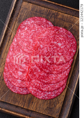 Delicious smoked salami sausage with salt, spices and herbs 121442179