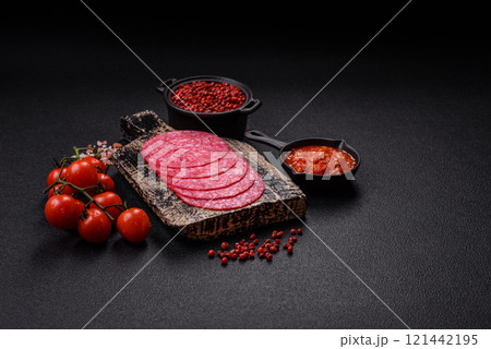 Delicious smoked salami sausage with salt, spices and herbs 121442195