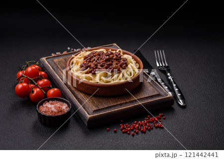 Rice noodles with beans, meat, tomato sauce, spices and herbs Rice noodles with beans, meat, tomato sauce, spices and herbs 121442441