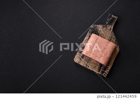 Delicious canned pink spiced ham or spam with salt, spices and herbs 121442459