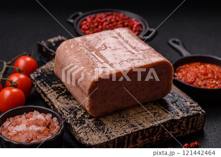 Delicious canned pink spiced ham or spam with salt, spices and herbs Delicious canned pink spiced ham or spam with salt, spices and herbs 121442464