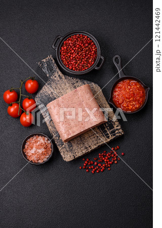 Delicious canned pink spiced ham or spam with salt, spices and herbs Delicious canned pink spiced ham or spam with salt, spices and herbs 121442469