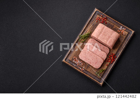 Delicious canned pink spiced ham or spam with salt, spices and herbs Delicious canned pink spiced ham or spam with salt, spices and herbs 121442482