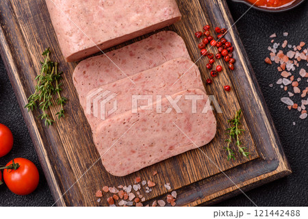 Delicious canned pink spiced ham or spam with salt, spices and herbs 121442488
