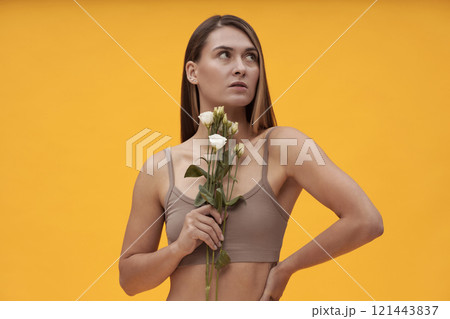 Pretty Girl Posing With Flowers 121443837