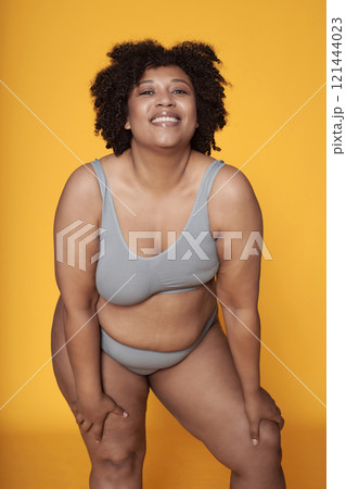 African American Body Positive Woman Posing At Camera 121444023