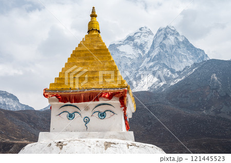 Ancient Tibetan Buddhist stupa with beautiful view of Mt.Ama Dablam located in Dingboche village Nepal. Ancient Tibetan Buddhist stupa with beautiful view of Mt.Ama Dablam located in Dingboche village Nepal. 121445523