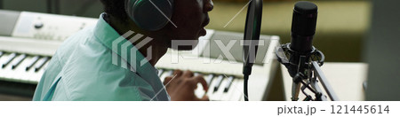 Man Recording Song In Studio 121445614