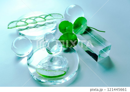 Delicate glass elements and aloe leaves create a serene spa environment filled with tranquility. Delicate glass elements and aloe leaves create a serene spa environment filled with tranquility. 121445661