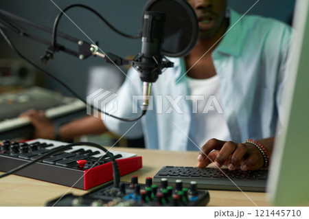 Man Playing Song In Mixing Console 121445710