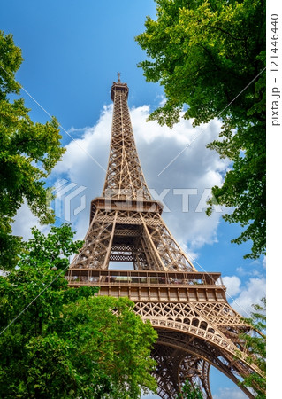 A Stunning View Of The Eiffel Tower Rising Through Lush Green Trees In Beautiful Paris, France A Stunning View Of The Eiffel Tower Rising Through Lush Green Trees In Beautiful Paris, France 121446440