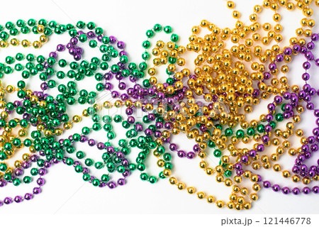 Mardi Gras beads on white background. 121446778