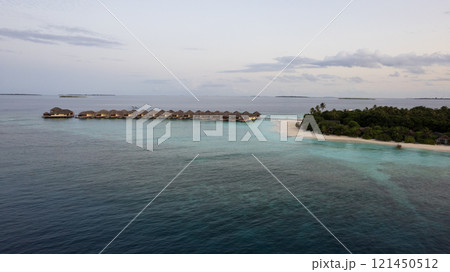 Top view of the sunset over an island in the ocean 121450512