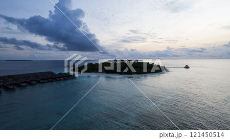 Top view of the sunset over an island in the ocean 121450514