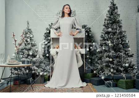 Graceful Woman in Stylish Winter Setting. 121450584