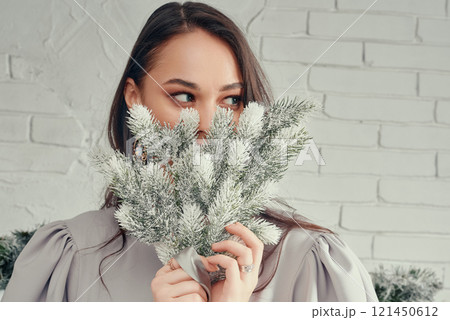 Woman Hiding Behind Frosted Bouquet. 121450612
