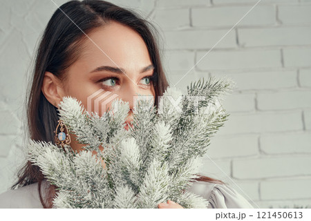Woman with Frosted Branches Close-Up. 121450613
