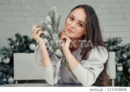 Elegant Woman Resting with Frosted Bouquet. 121450698