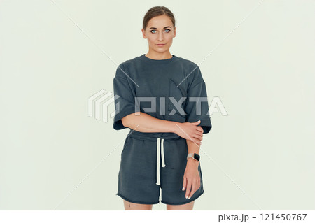 Confident Fitness Coach in Relaxed Attire. 121450767