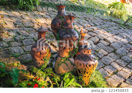 Antique clay jugs and vases decorate Asian garden in Asia in summer Antique clay jugs and vases decorate Asian garden in Asia in summer 121450835