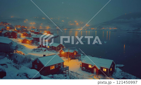 Colorful houses glow along Greenlands snowy coast, creating a cozy nighttime atmosphere Colorful houses glow along Greenlands snowy coast, creating a cozy nighttime atmosphere 121450997
