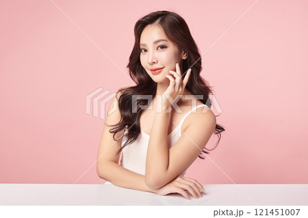 Beautiful young asian woman with clean fresh skin on pink background, Face care, Facial treatment, Cosmetology, beauty and spa, Asian women portrait. Beautiful young asian woman with clean fresh skin on pink background, Face care, Facial treatment, Cosmetology, beauty and spa, Asian women portrait. 121451007