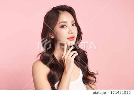 Beautiful young asian woman with clean fresh skin on pink background, Face care, Facial treatment, Cosmetology, beauty and spa, Asian women portrait. 121451010