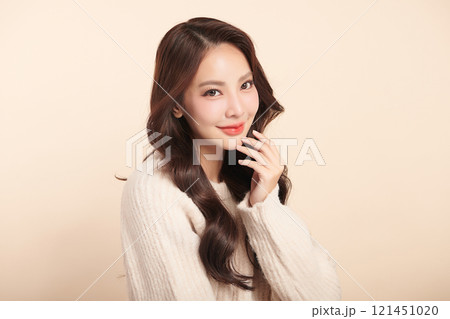 Beautiful young asian woman with clean fresh skin on beige background, Face care, Facial treatment, Cosmetology, beauty and spa, Asian women portrait. 121451020