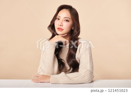 Beautiful young asian woman with clean fresh skin on beige background, Face care, Facial treatment, Cosmetology, beauty and spa, Asian women portrait. Beautiful young asian woman with clean fresh skin on beige background, Face care, Facial treatment, Cosmetology, beauty and spa, Asian women portrait. 121451023