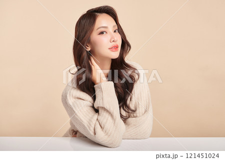 Beautiful young asian woman with clean fresh skin on beige background, Face care, Facial treatment, Cosmetology, beauty and spa, Asian women portrait. 121451024