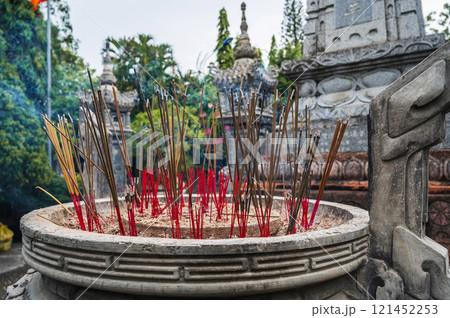 smoking incense sticks on Buddhist pagoda in Vietnam in Asia 121452253