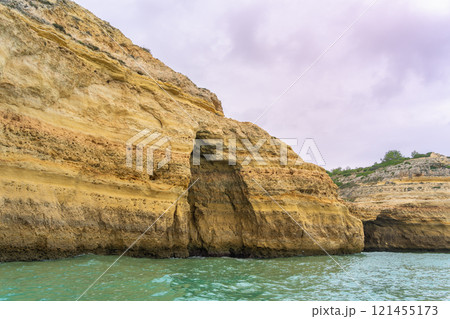 Majestic Coastal Cliffs and Sea Caves in Algarve, Portugal. 121455173