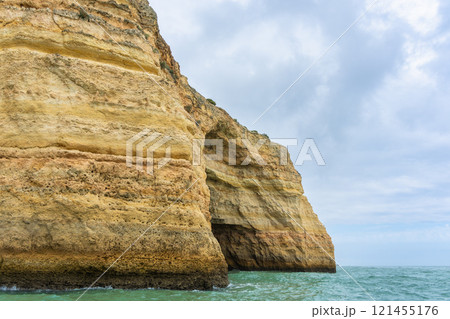Majestic Coastal Cliffs and Sea Caves in Algarve, Portugal. Majestic Coastal Cliffs and Sea Caves in Algarve, Portugal. 121455176