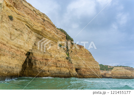 Majestic Coastal Cliffs and Sea Caves in Algarve, Portugal. 121455177