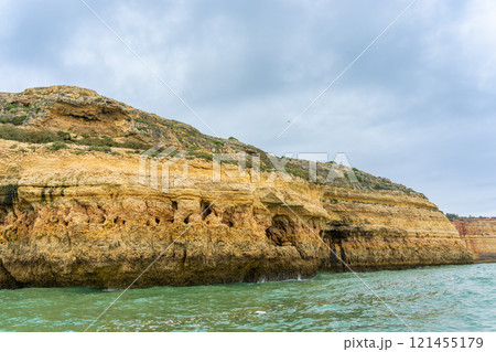 Majestic Coastal Cliffs and Sea Caves in Algarve, Portugal. Majestic Coastal Cliffs and Sea Caves in Algarve, Portugal. 121455179