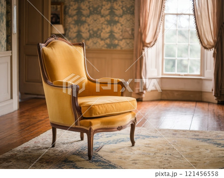 Elegant yellow chair positioned in a cozy room with vintage decor and natural light 121456558