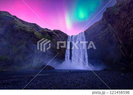 Aurora Borealis over famous Skogafoss waterfall on Skoga river Aurora Borealis over famous Skogafoss waterfall on Skoga river 121456596