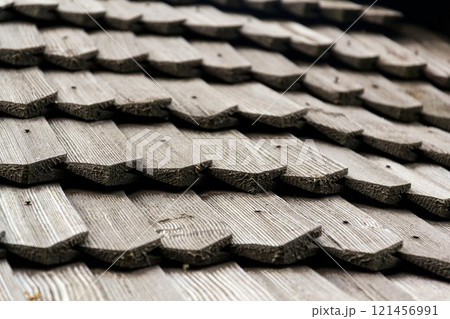 Old traditional wooden shingled roof pattern background, copy space Old traditional wooden shingled roof pattern background, copy space 121456991